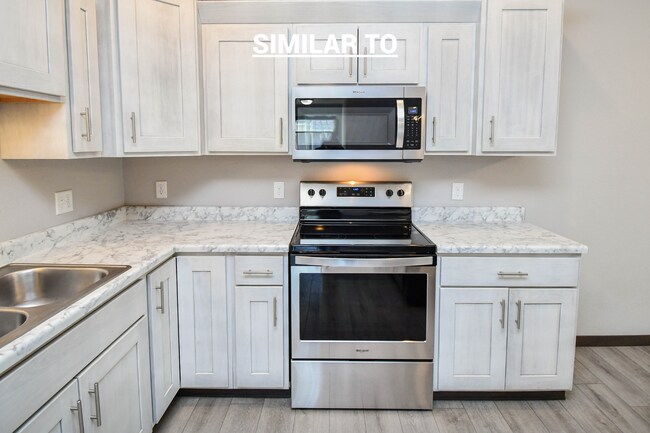 Building Photo - East Sioux Falls 4-Bedroom Townhome – Style, Space & Convenience!