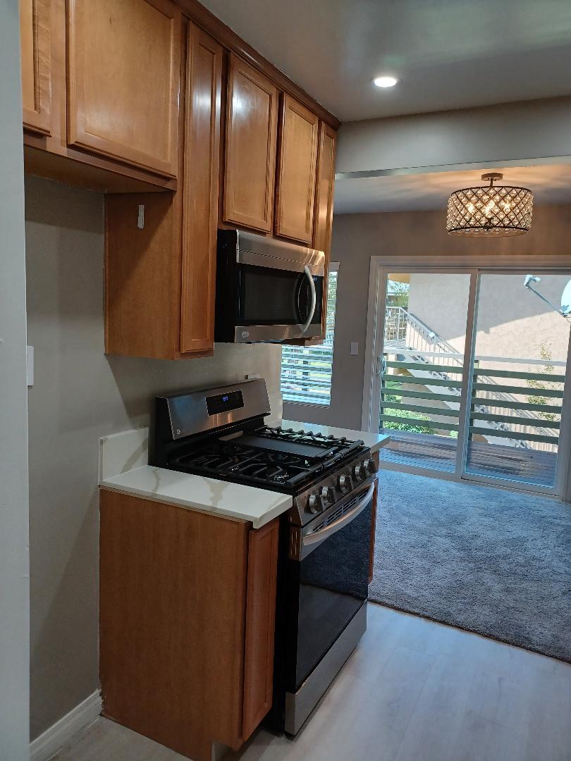 Stove and dinning area - 1440 Lambert W Rd
