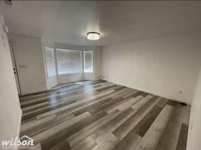 Building Photo - 3 Bed, 2 Bath Home with a Two-Car Garage, Fenced Backyard, and Lawn Care Included