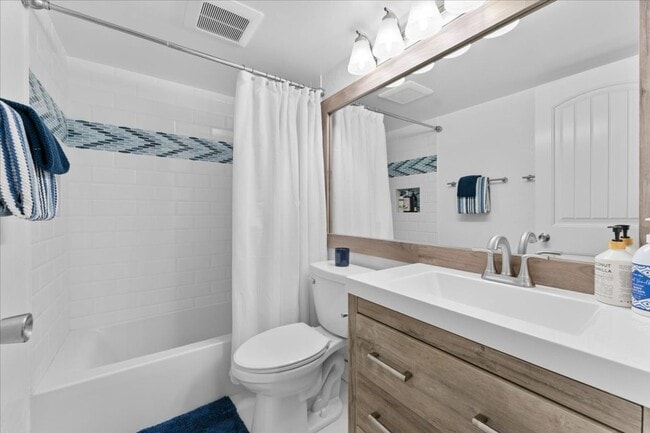 Building Photo - SKI LEASE:  Updated Townhome in Wooded, Central North Lake Location!