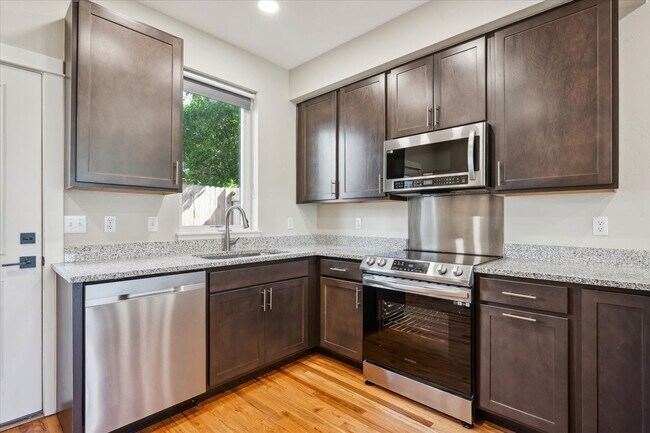 Building Photo - Modern 4-Bedroom Townhome with Rooftop Deck Near Sloan’s Lake & Light Rail