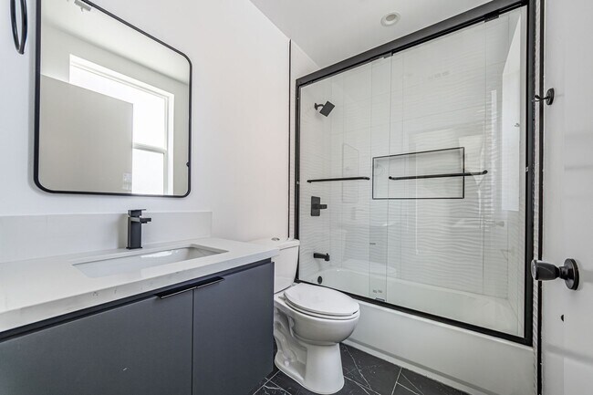 Building Photo - Designer-inspired, tri-level townhome offe...