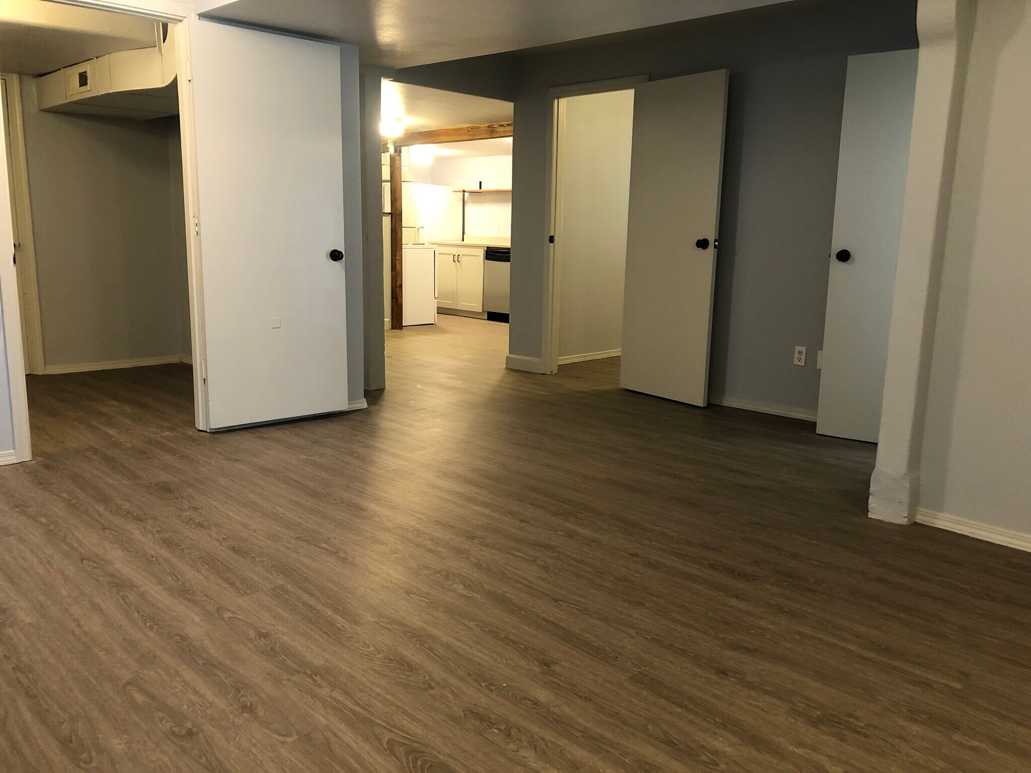 Living room looking to kitchen, bedrooms and office. - 105 W 2nd St Lower