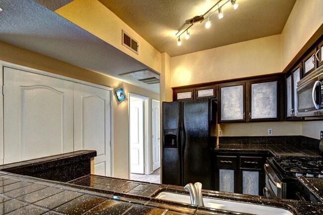 Building Photo - FANTASTIC HIGHLY UPGRADED UNIT FACING THE PARK AND POOL.