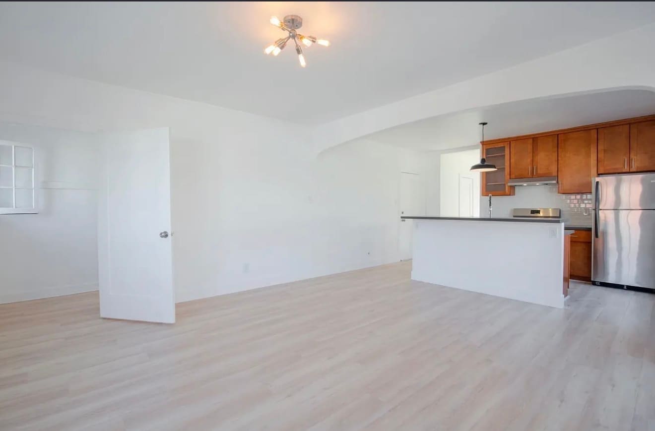 view from the living room looking at kitchen. View of front door plus a closet where door is open - 1704 Miramar St