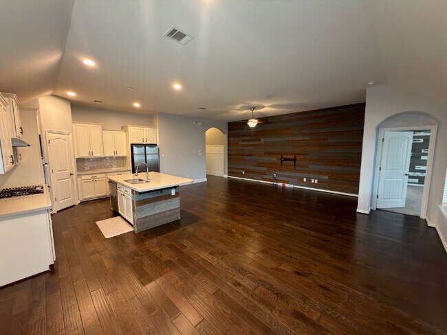 Building Photo - Four bed two bath on a corner lot with a pool in Sunfield. Gas cook top, double ovens. Open kitch...