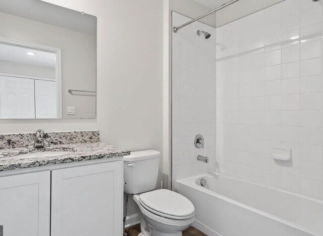 Building Photo - Free Application Fee — Refunded Upon Approval Through August 31! Modern 3BR/3BA Townhome with Gar...