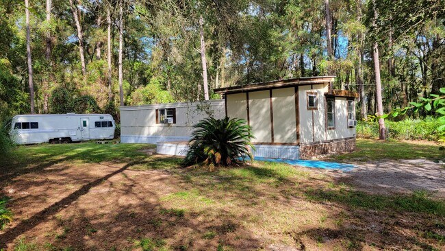 Building Photo - 2 Bed | 1 1/2 Bath | Fenced & Gated 1/4 Acre of land