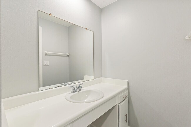 Experience sophistication with this elegant bathroom vanity design. - Country Club