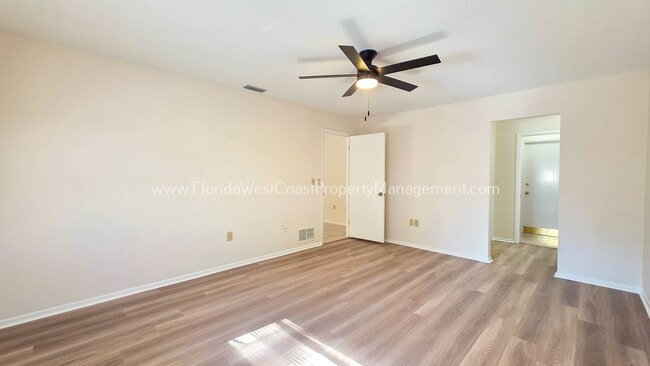 Building Photo - SPACIOUS SARASOTA HOME WITH LARGE FENCED YARD! MOVE IN READY! ALL TILE/ NEW LVP!