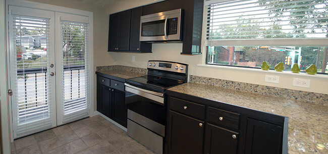 French doors open to kitchen balcony - 8710 Park Ln