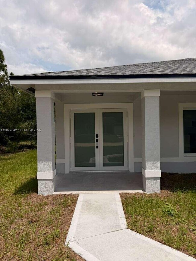 Building Photo - 8636 100th Ct
