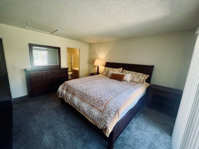 Building Photo - Affordable Comfort in 55+ Guard-Gated Comm...