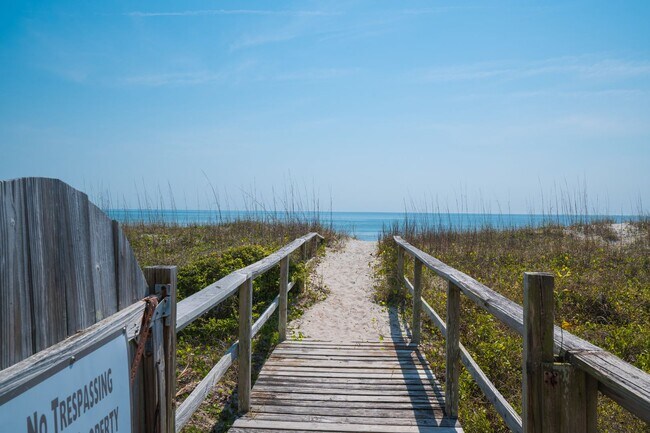 Building Photo - SPEND YOUR OFF-SEASON AT THIS TOP FLOOR OCEANFRONT CONDO