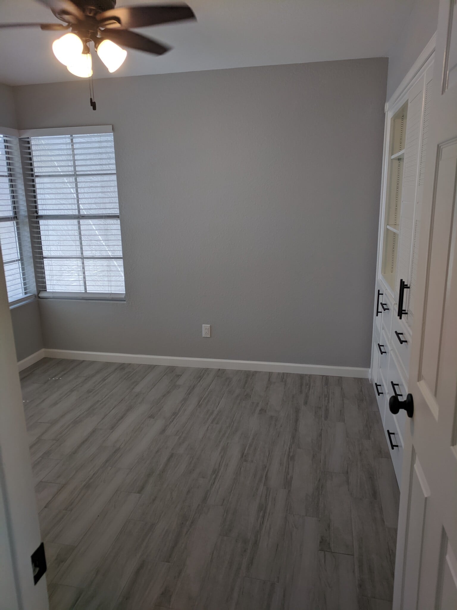 Room 1 - 10' x 10'. Faux wood blinds on 2 windows. Facing North - 14101 N 78th Dr