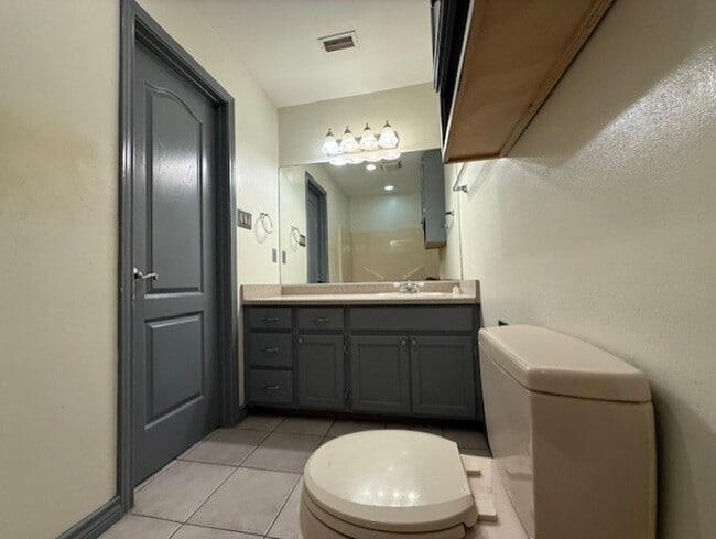 Building Photo - Downstairs -Three-bedroom Condo