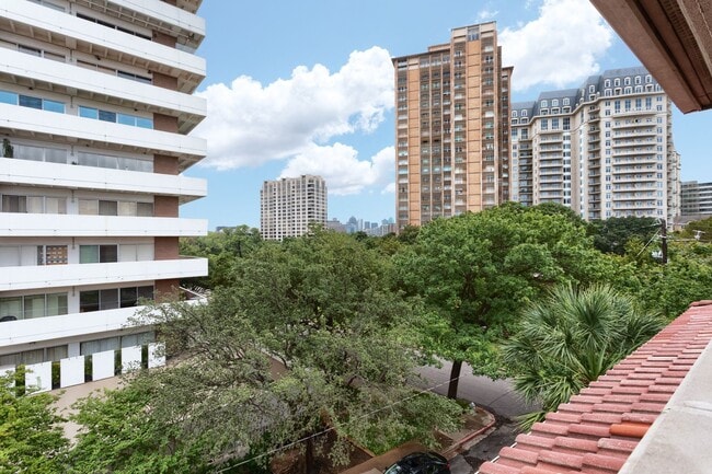 Building Photo - Gorgeous Mediterranean-style condo located...