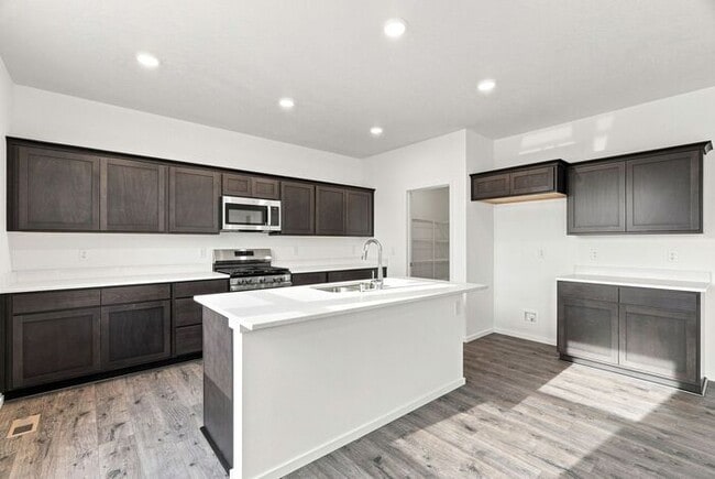 Building Photo - Spacious 5-Bedroom with Loft with 3-Car Garage