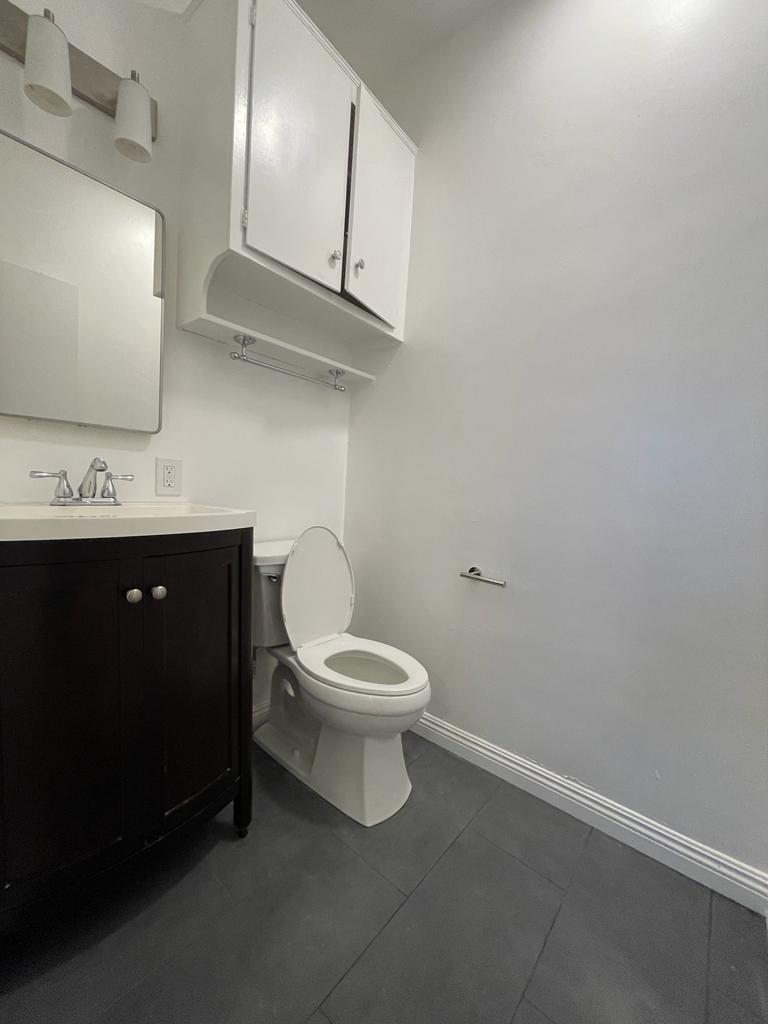 half bathroom with main bedroom - 7855 W Manchester Ave