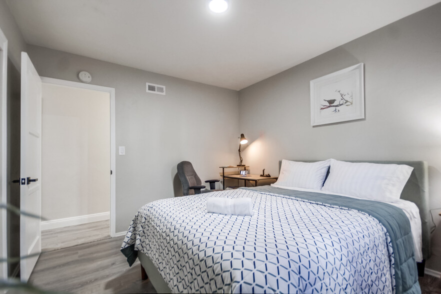 You'll find a cozy queen bed in Bedroom 2 & a nearby workspace for productivity - 5551 Churchward St