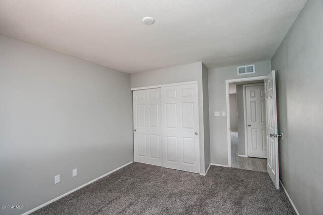 Building Photo - COMPLETELY REMODELED 4 BEDROOM, 2 BATH TEM...