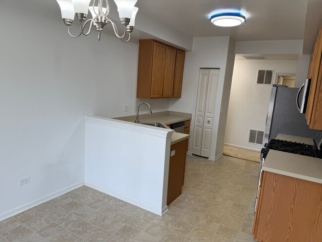 Building Photo - Partially Furnished - Bright & Spacious 2BR/1.5 BA CONDO - End-Unit w/ 2-Car Garage, Appliances, ...