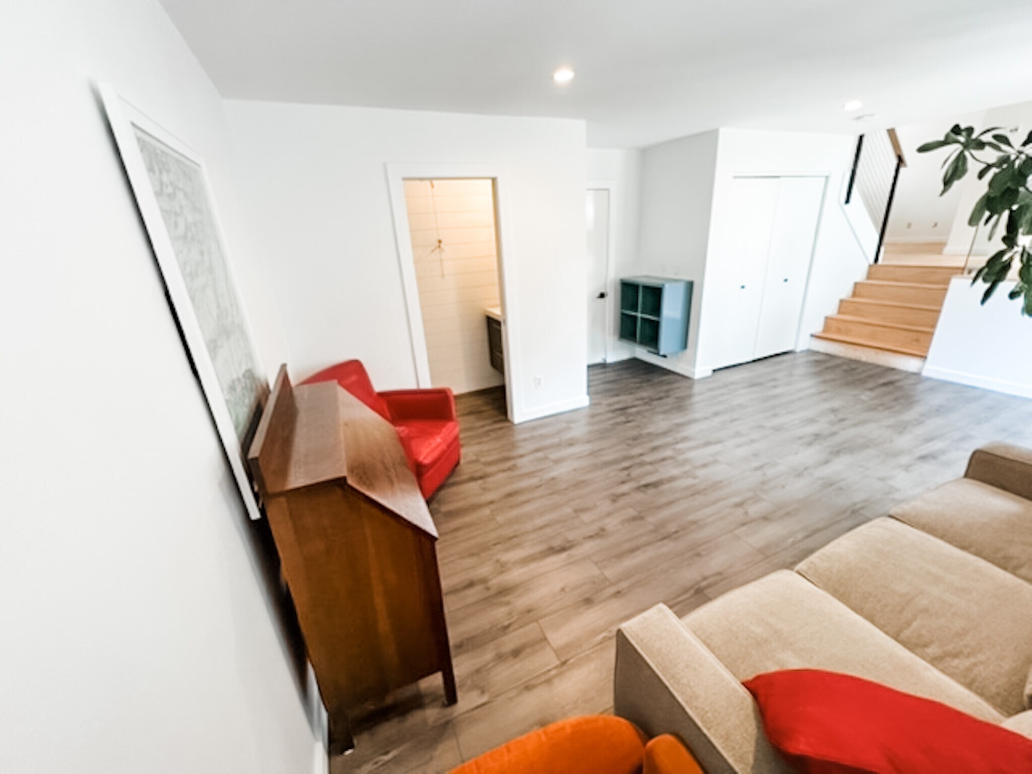 Lower den, which walks out to back yard. 1/2 bath on left, garage entrance in middle, and laundry on - 649 Foxtail St