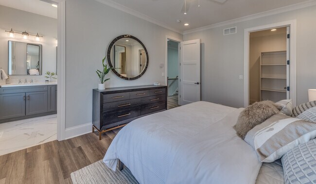 Spacious bedrooms with attached bathrooms. - Eldridge Townhomes