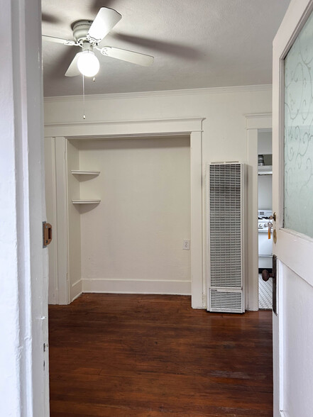 Alcove in living room, wall heater and into kitchen. - 211 Linden Avenue