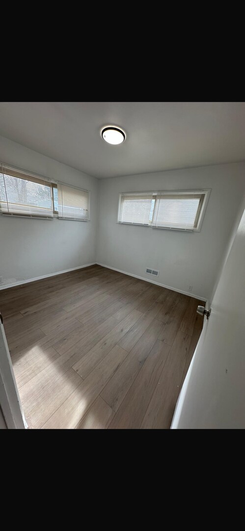 Building Photo - This is a 4 bedroom 1 bathroom house it has a spacious living room and full kitchen that comes wi...