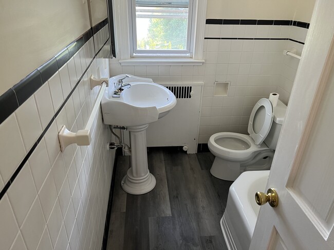 Renovated bathroom with shower tub - 154 Grand St