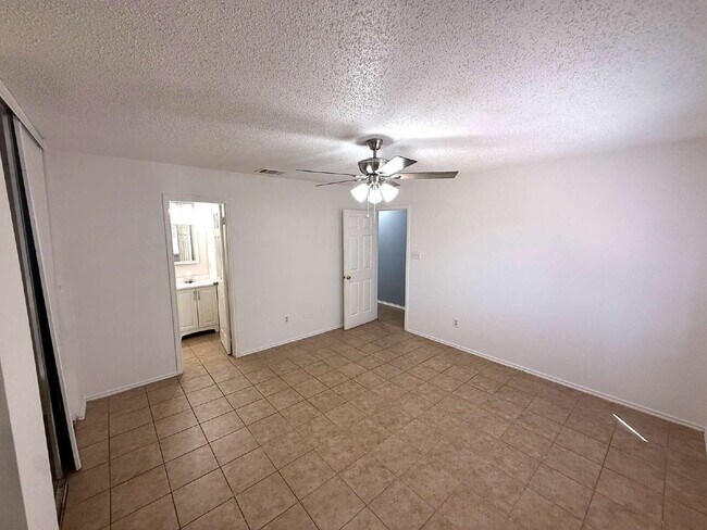 Building Photo - Move-In Ready 3BR/2BA: Updated Kitchen, New Light Fixtures & Fenced Yard