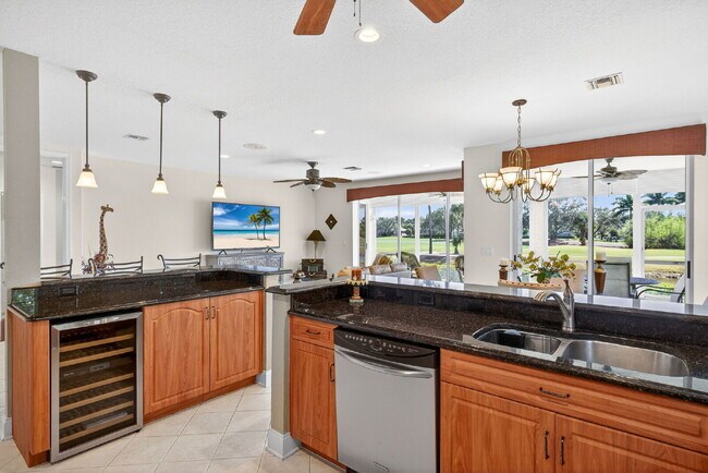 Building Photo - This 2 bedroom plus den, 2 bath condo with a one car garage offers expansive golf course and lake...