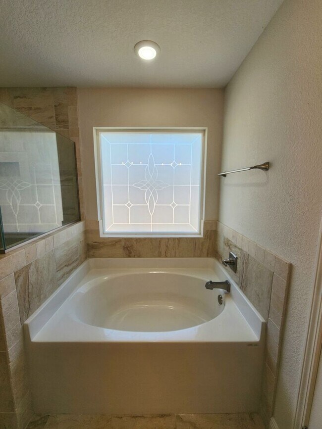 Building Photo - Welcome to this stunning 4-bedroom, 3-bath...