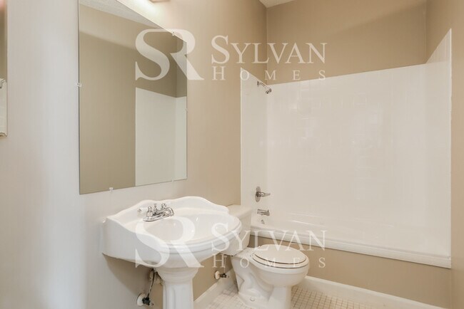 Building Photo - The living is easy in this 4 bedroom, 2 bathroom home