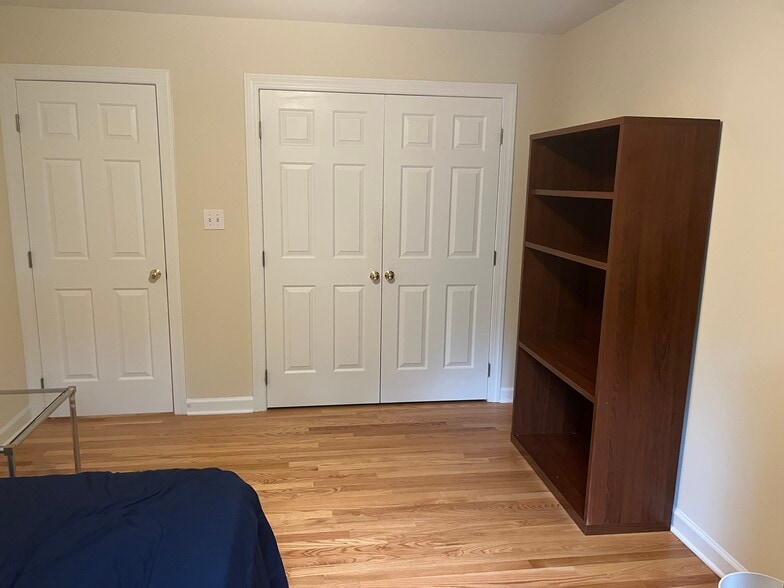 Bookshelf and closet in furnished bedroom - 209 Cates Farm Rd