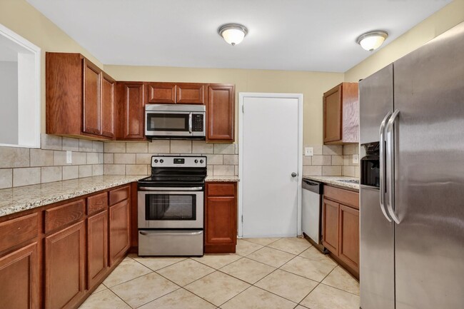 Building Photo - Unbeatable Prairie Village Location - 3BR/1BA Home, Fully Fenced Yard, Laundry Hook Ups, Attached...