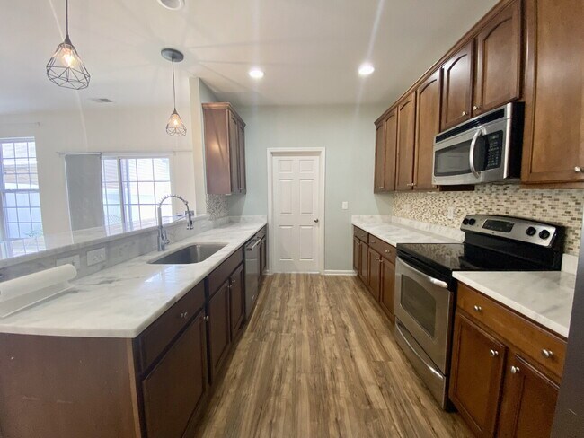 Building Photo - Spacious, Four Bedroom Townhouse With a View!