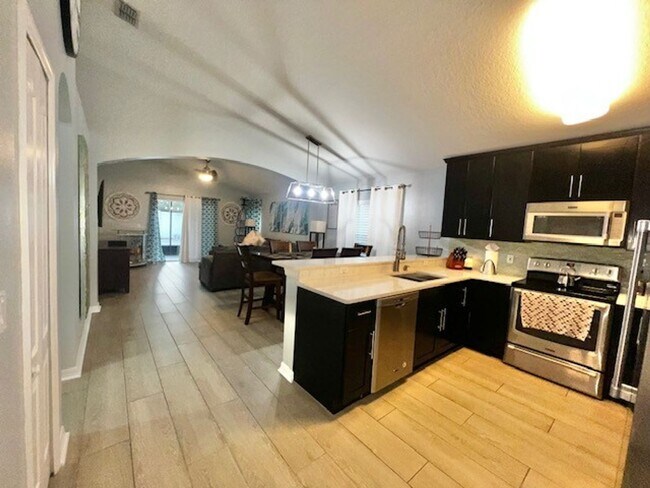 Building Photo - Lake Nona!! Spectacular 4X2 in Gated Nona Crest! All tile flooring!! 2 car garage! Move in April ...