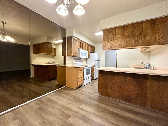Building Photo - Beautiful Downstairs 2 Bedroom Condo Located In Gated Community Pool + Lake Access!