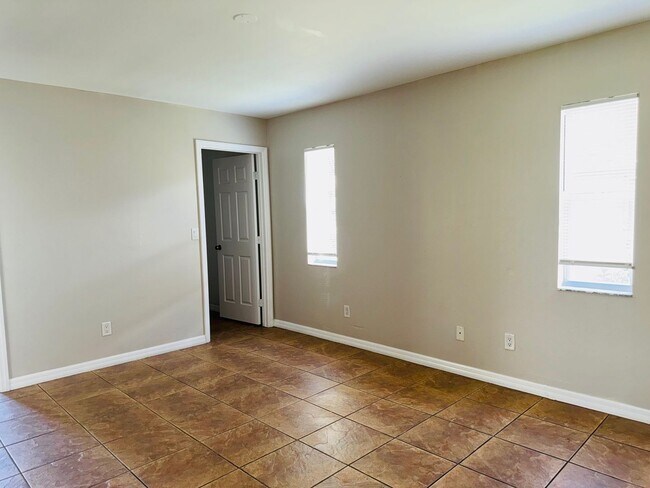 Building Photo - Experience this Cape Coral 3 bedroom 2 bath corner duplex with 1 car garage and screened in lanai.