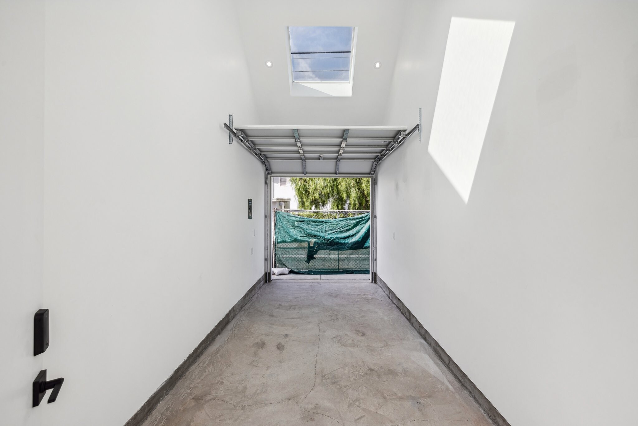 16 ft Ceiling garage space w operable skylights. Office, gym, storage or parking. - 1169 Palms Blvd