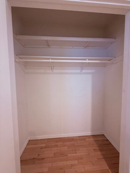 Primary Bed Walk In Closet #2 with built in shelving - 811 S Catalina Ave