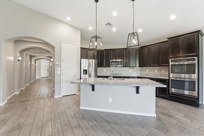 Building Photo - Stunning 4-Bed + Den Eastmark Home with Modern Upgrades Throughout