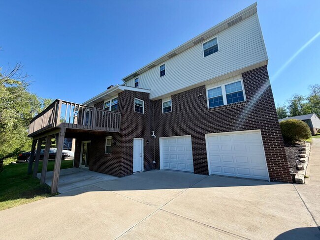Building Photo - Modern Comforts Await: Spacious Rental with 2-Car Garage, Private Office, and Finished Basement w...