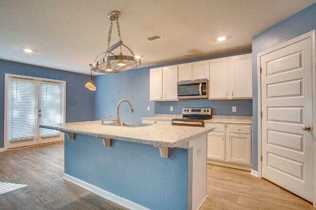 Building Photo - Season’s Savings! Spacious 5BR Near NAS – Military Half Deposit & $500 Off First Month!