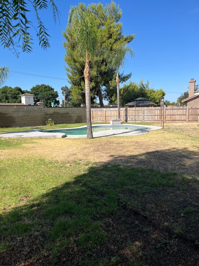 Building Photo - 4 Bedroom, 2 Bathroom Home with a Pool in ...