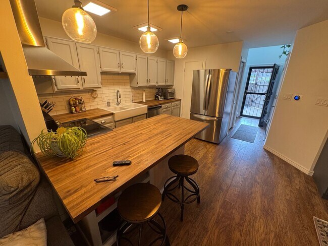 Building Photo - Bright 2BR Townhome with 3 Balconies & Private Patio