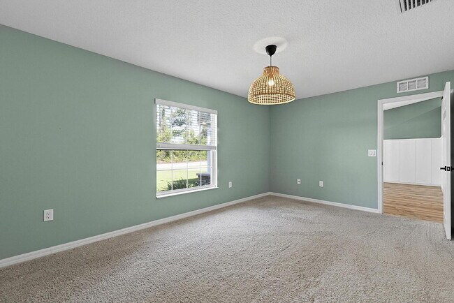 Building Photo - Modern 4-Bedroom, 3-Bath Home with Private In-Law Suite – Palm Coast, FL