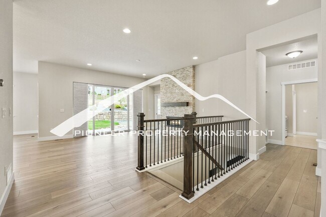 Building Photo - Main Floor Primary Home in Flying Horse with 5 Bedrooms, Gourmet Kitchen, Finished Basement & 4-C...